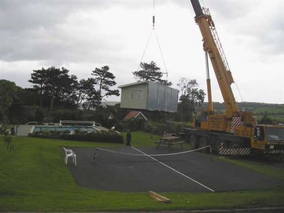 Crane Moving a Caravan